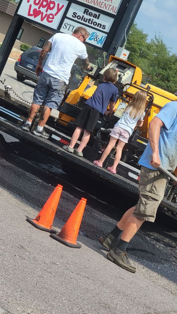 Chris Bolte with the grandkids on the paver